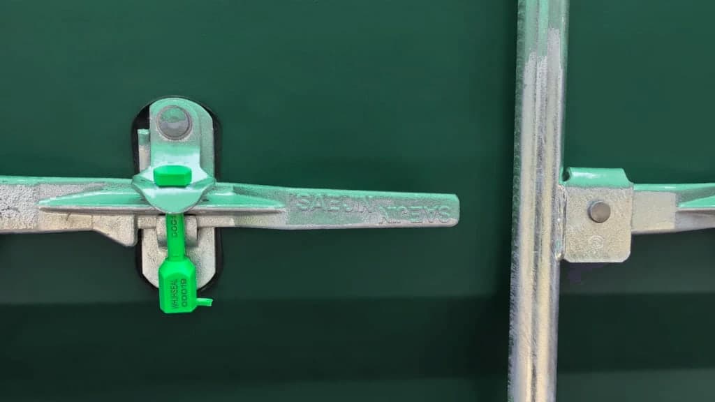 Closed container door with a numbered security seal