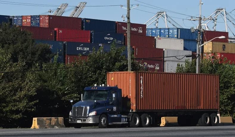 Truck with a container on the chassis at the port